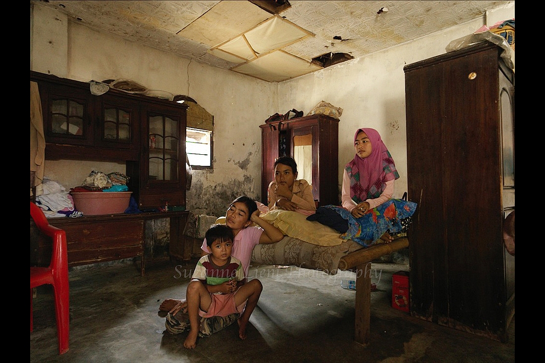 The son of Bapak Saih and his family started a shop selling filtered water to the villagers. They have shared the compensation money with the victim-families and on top of that shared some of it with people in need.